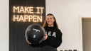 Someone holding an exercise ball.