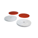 Two red and two white weight plates on a white background