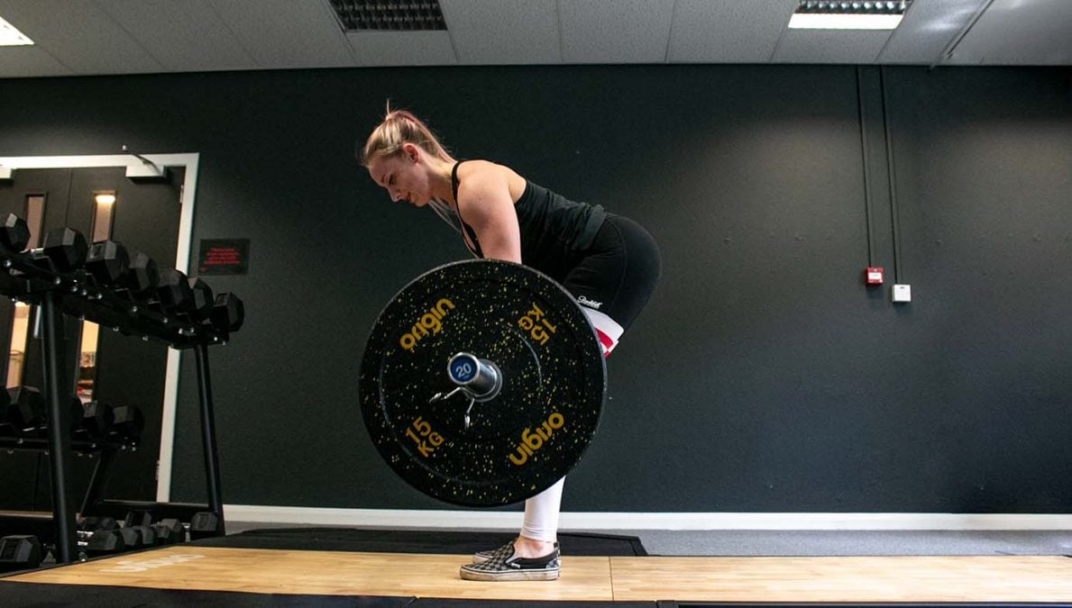 Sarah deadlifting with origin rubber crumb plates